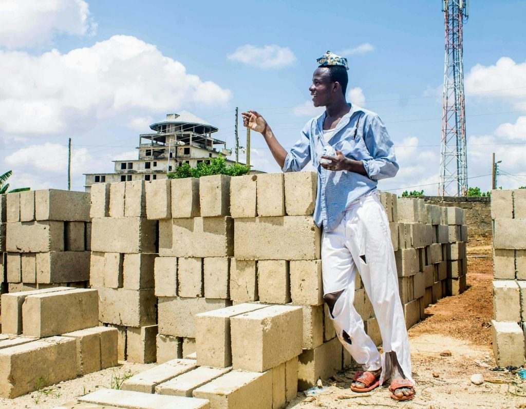 A young labourer working in a fresh construction site